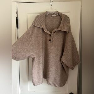 Oversized sweater. Short sleeves buttons and collar